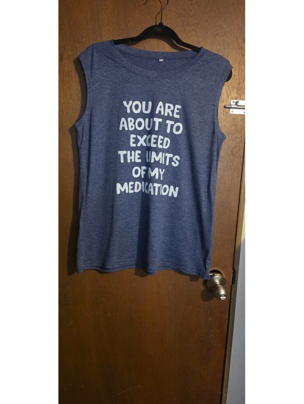 Sleeveless Blue Graphic Tee with 'You Are About to Exceed the Limits of My Medd'